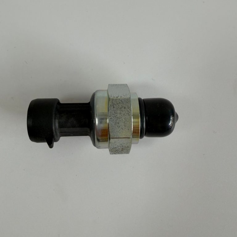 Excavator pressure sensor with black electrical connector, silver hex body and black protective cap
