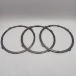 Dark annular KYB MAG170 excavator travel motor friction plates with outer locating tabs