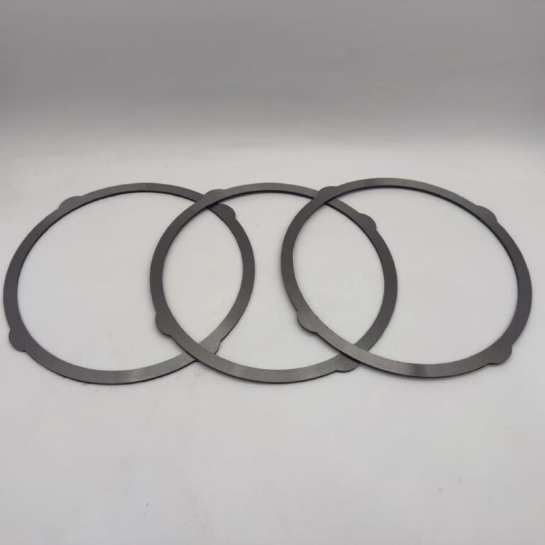 Dark annular KYB MAG170 excavator travel motor friction plates with outer locating tabs